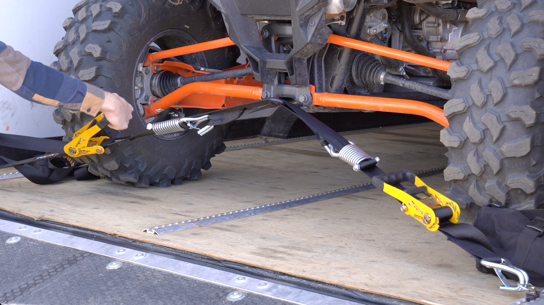 TorkStrap Pro holding down a large UTV on a trailer